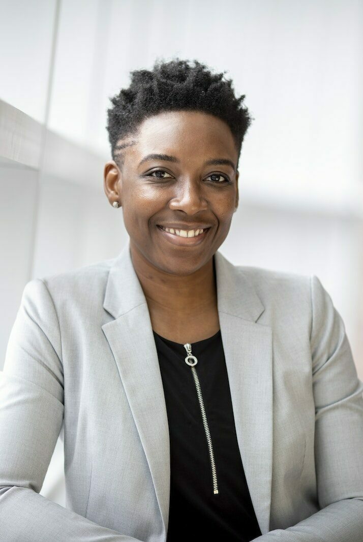 Woman Wearing Gray Notch Lapel Suit Jacket